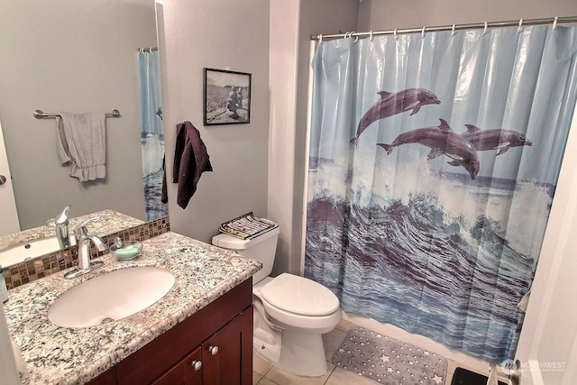 bathroom featuring a shower with shower curtain, tile patterned floors, vanity, and toilet