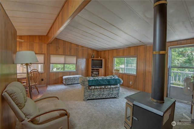 living room featuring a healthy amount of sunlight, carpet floors, and lofted ceiling