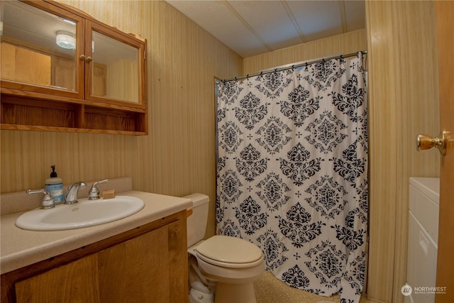 bathroom featuring vanity, a shower with shower curtain, and toilet