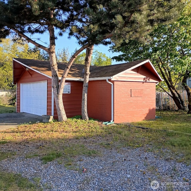 14607 Union Ave SW, Lakewood, WA 98498 - view of property exterior featuring a detached garage and roof with shingles