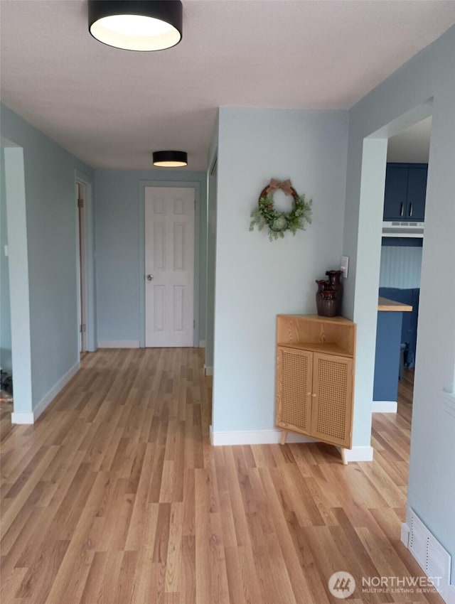 14607 Union Ave SW, Lakewood, WA 98498 - hallway with light wood-style floors and baseboards