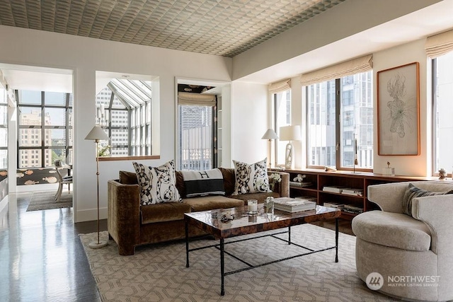 living room featuring wood-type flooring and brick ceiling