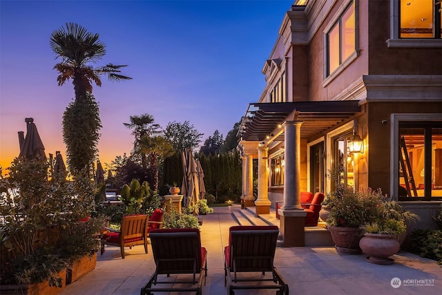 view of patio terrace at dusk