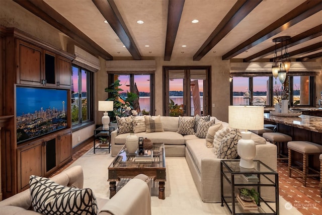 living room featuring beamed ceiling