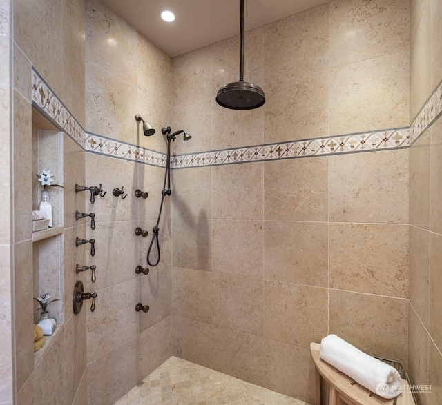 bathroom with a tile shower