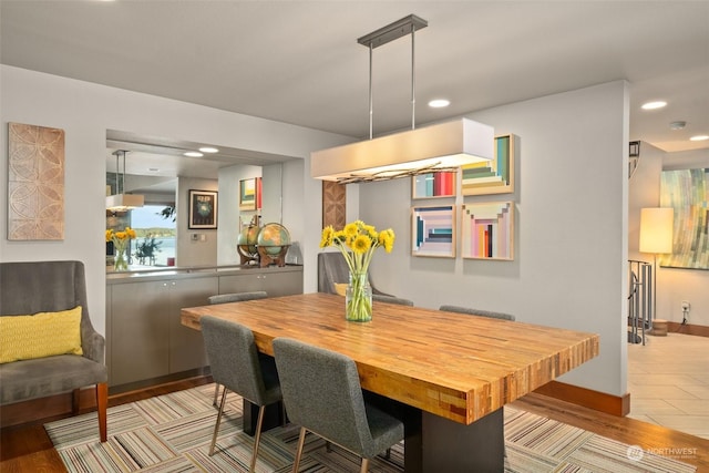 dining space with light hardwood / wood-style flooring