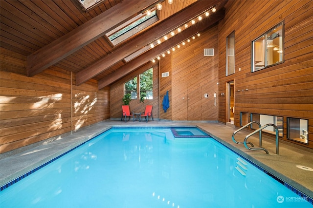 view of pool with a skylight