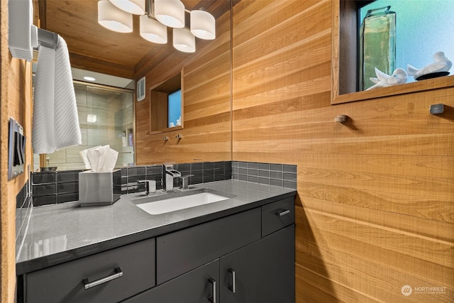 bathroom featuring wood walls, vanity, and wood ceiling