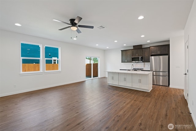 11118 NE 91st Ave, Vancouver, WA 98662 - kitchen featuring an island with sink, appliances with stainless steel finishes, dark wood-style floors, visible vents, and open floor plan
