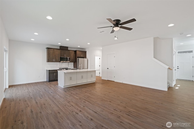 11118 NE 91st Ave, Vancouver, WA 98662 - kitchen featuring open floor plan, wood finished floors, stainless steel appliances, and a center island with sink