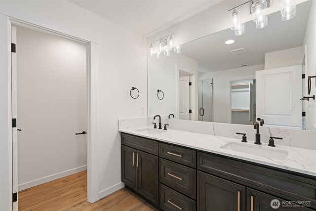 11118 NE 91st Ave, Vancouver, WA 98662 - full bathroom featuring double vanity, wood finished floors, baseboards, and a sink