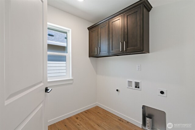 11118 NE 91st Ave, Vancouver, WA 98662 - laundry room featuring cabinet space, washer hookup, a healthy amount of sunlight, electric dryer hookup, and light wood-style flooring