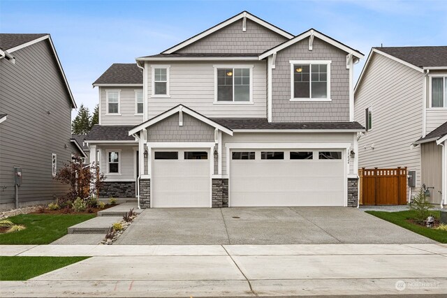 craftsman inspired home featuring a garage