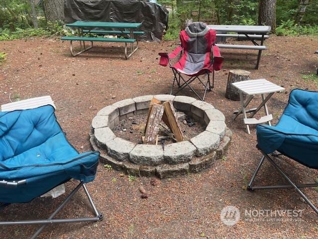 view of patio with a fire pit