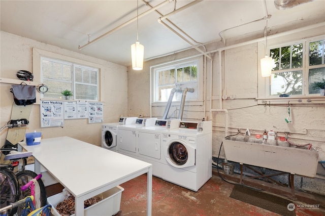 laundry area with sink and independent washer and dryer