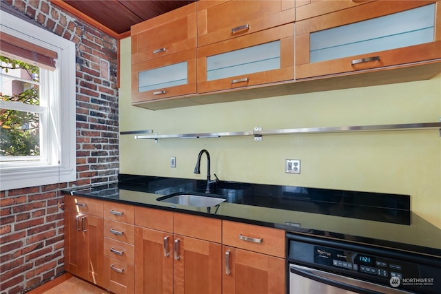 kitchen with wooden ceiling, sink, stainless steel oven, and brick wall