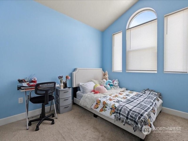 bedroom featuring lofted ceiling and light colored carpet