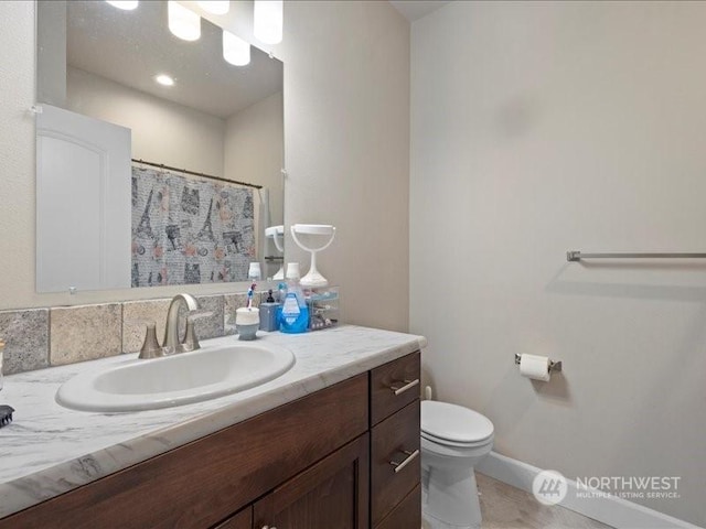 bathroom with vanity and toilet