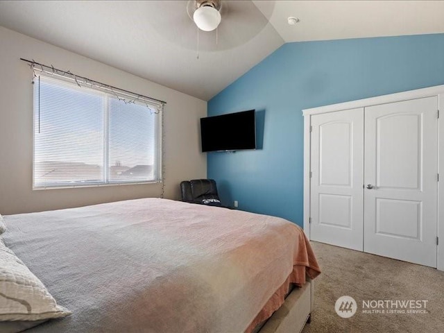 carpeted bedroom featuring vaulted ceiling and ceiling fan