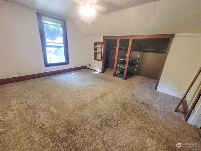 bonus room with carpet and lofted ceiling