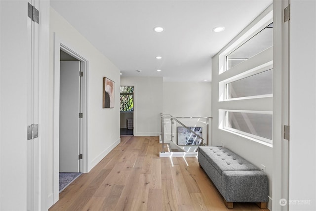 hallway with light hardwood / wood-style flooring