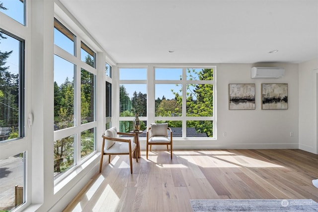 sunroom / solarium featuring a wall unit AC