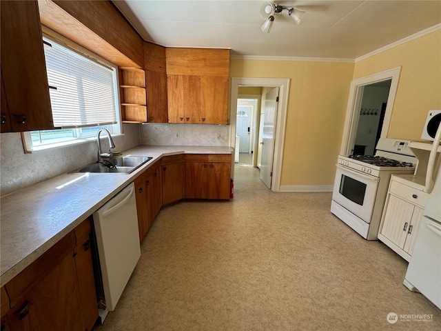 kitchen with tasteful backsplash, crown molding, sink, and white appliances