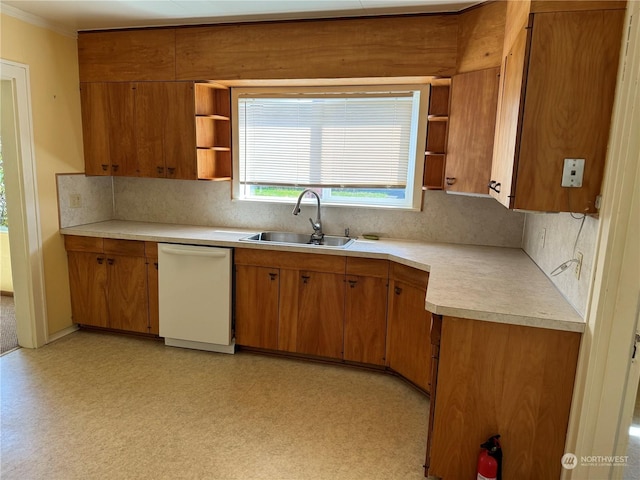 kitchen featuring tasteful backsplash, sink, and white dishwasher