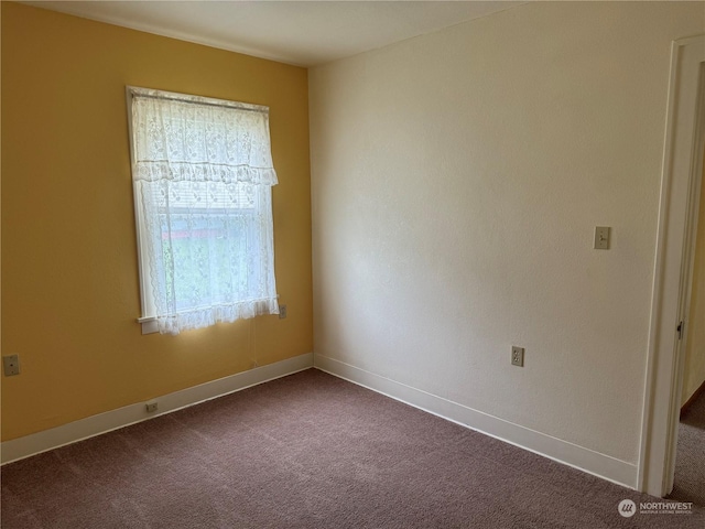 unfurnished room with carpet flooring