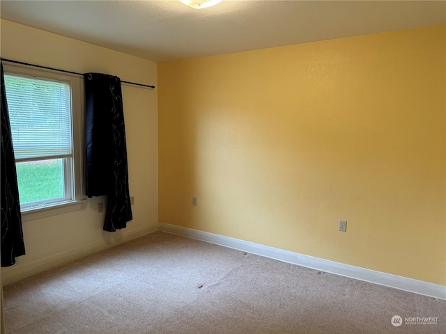 empty room with light colored carpet