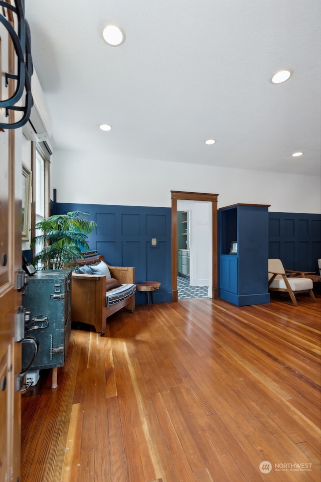 living area featuring hardwood / wood-style floors