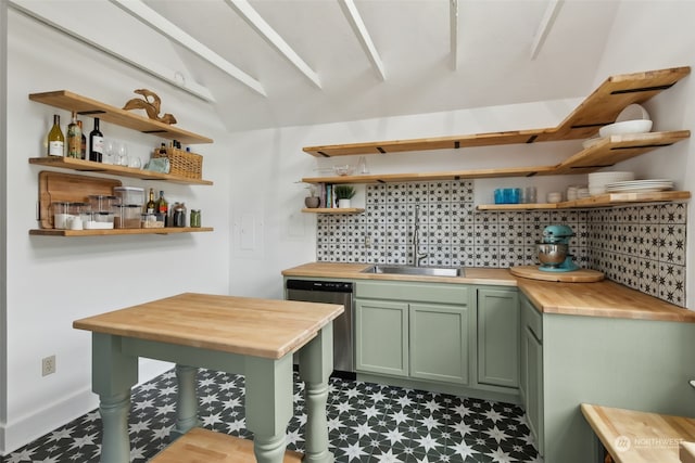 kitchen with sink, wooden counters, dishwasher, backsplash, and green cabinetry