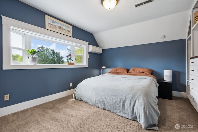 bedroom with lofted ceiling, carpet floors, and a wall mounted AC