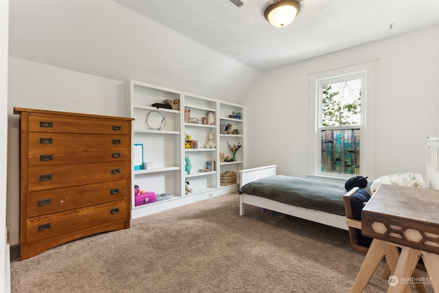 carpeted bedroom with vaulted ceiling