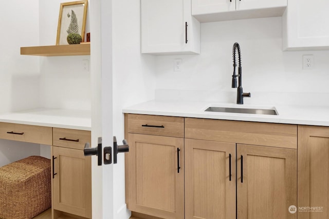 kitchen featuring light brown cabinetry and sink