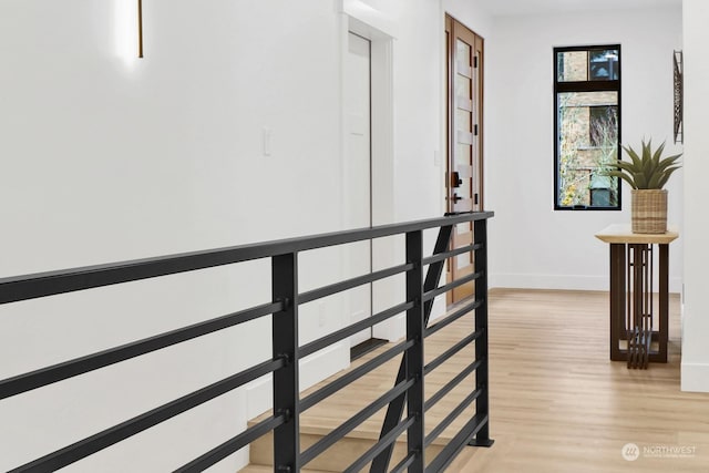 hall with light hardwood / wood-style floors