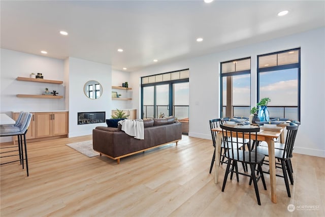 dining space featuring light wood-type flooring