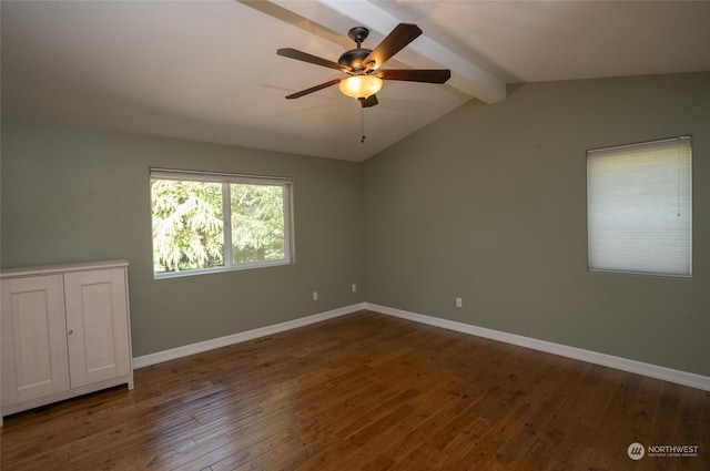 empty room featuring dark hardwood / wood-style flooring, lofted ceiling with beams, and ceiling fan