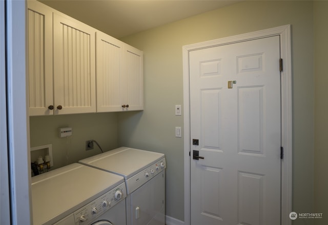 laundry room with separate washer and dryer, washer hookup, hookup for an electric dryer, and cabinets