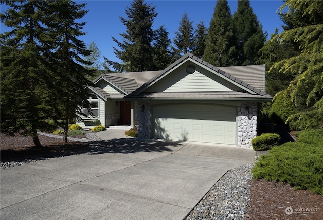 ranch-style home featuring a garage