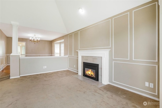 unfurnished living room with a fireplace, light colored carpet, lofted ceiling, and an inviting chandelier