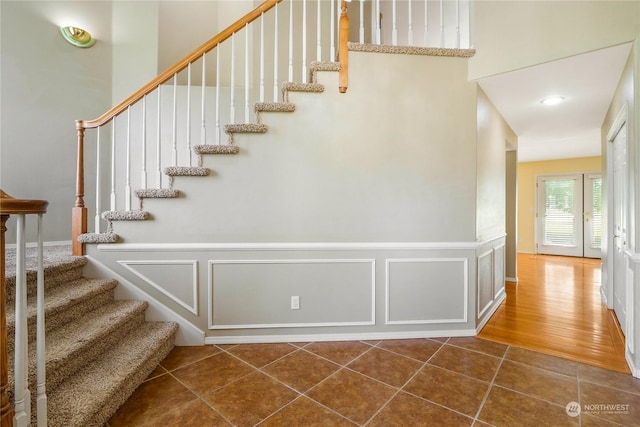 stairway featuring wood-type flooring