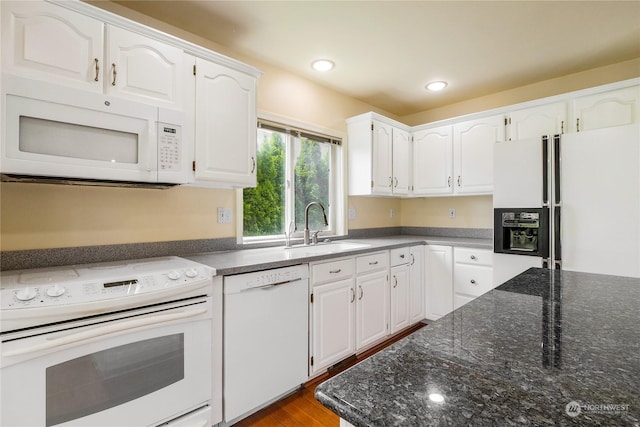 kitchen with white cabinetry, white appliances, sink, and dark wood-type flooring