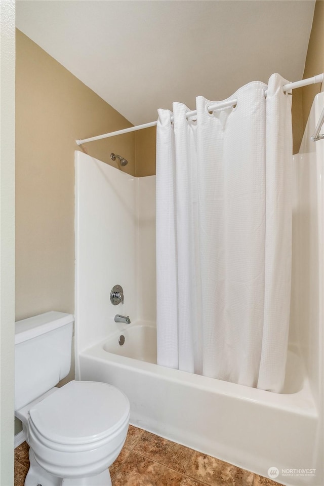 bathroom with tile patterned flooring and toilet