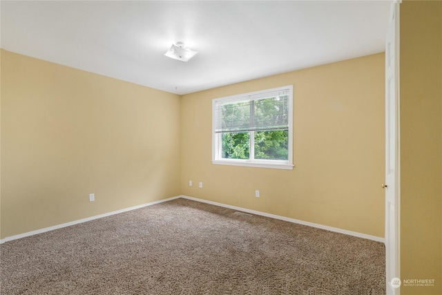 empty room with carpet flooring