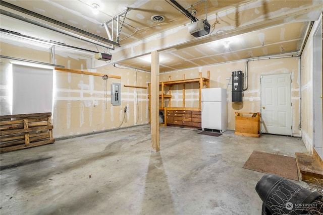 garage with electric panel, white fridge, and a garage door opener