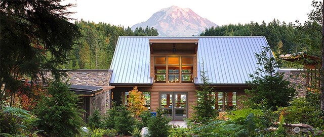 exterior space featuring french doors and a mountain view