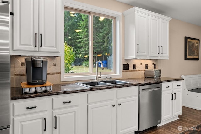 kitchen with white cabinetry, sink, and appliances with stainless steel finishes