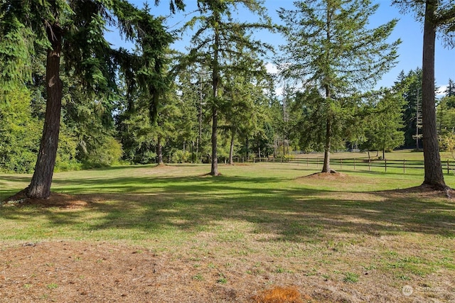 view of property's community with a lawn