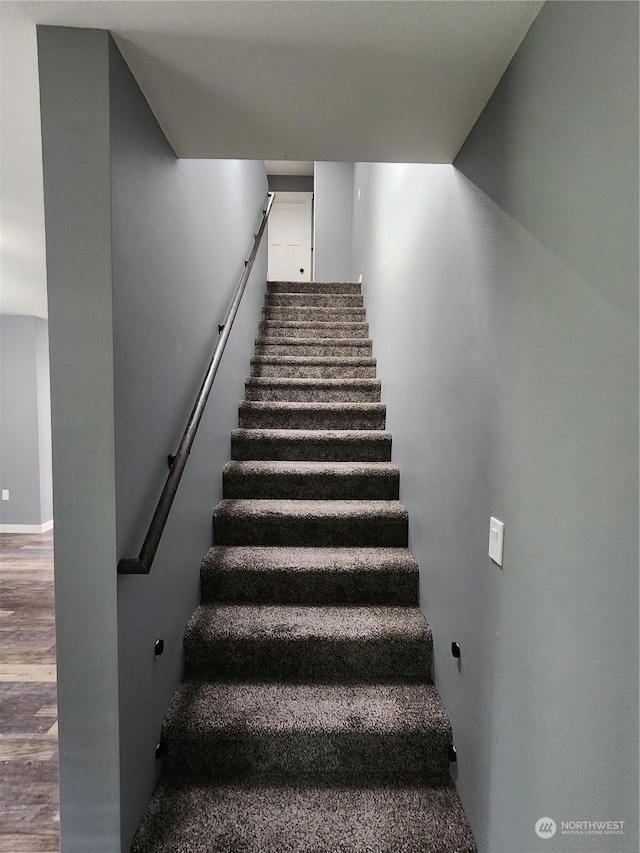 stairs with wood finished floors